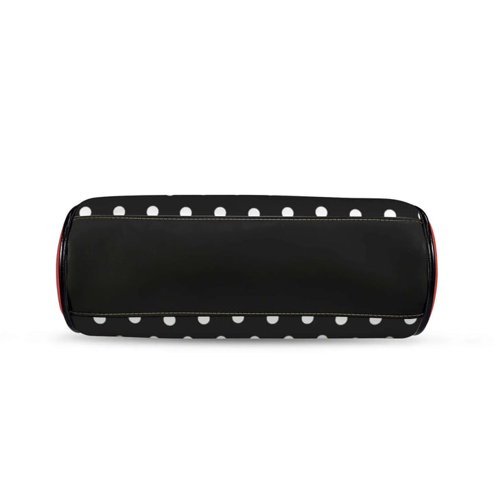 Polly Kisslock Vintage Handbag in black and white polka dots with red trim, showcasing a stylish retro design.