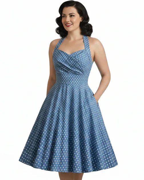 Blue vintage-style women’s halter dress with white polka dots and full swing skirt
