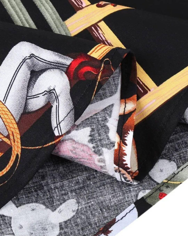 Close-up of Tropical Pinups Black Western Cowgirl Swing Dress fabric featuring vintage cowgirl prints.