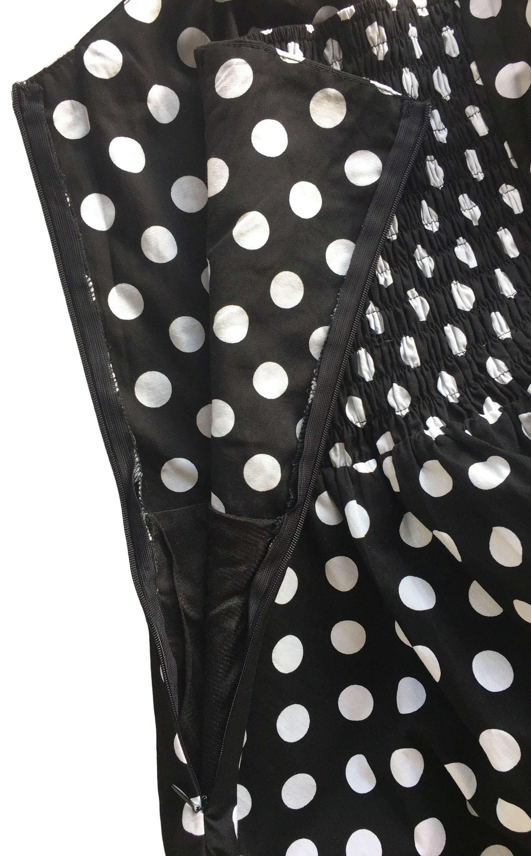 Close-up of the Black Polkadot Rockabilly Swing Dresses showcasing the polka dot pattern and adjustable corset back.