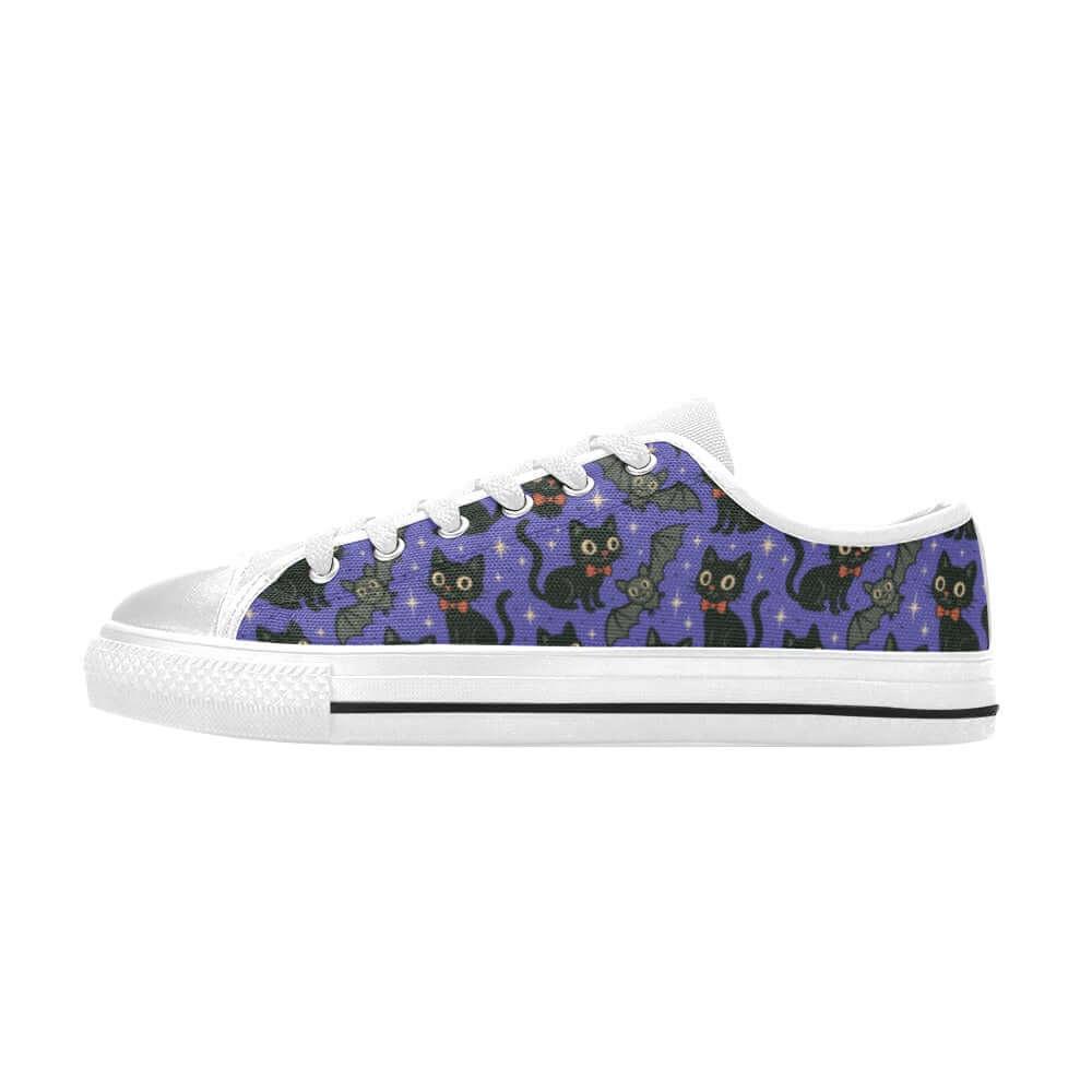 Spooky Cats n Bats Kids Sneakers featuring playful black cats and wide-eyed bats on a purple starry background.