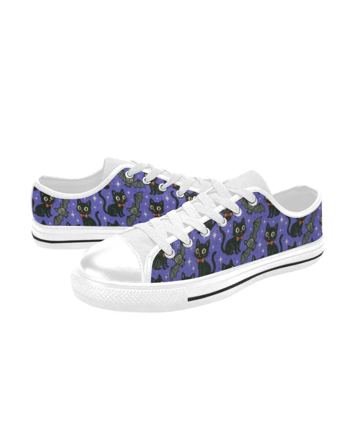 Spooky Cats n Bats Kids Sneakers featuring playful black cats and bats on a purple starry canvas background.