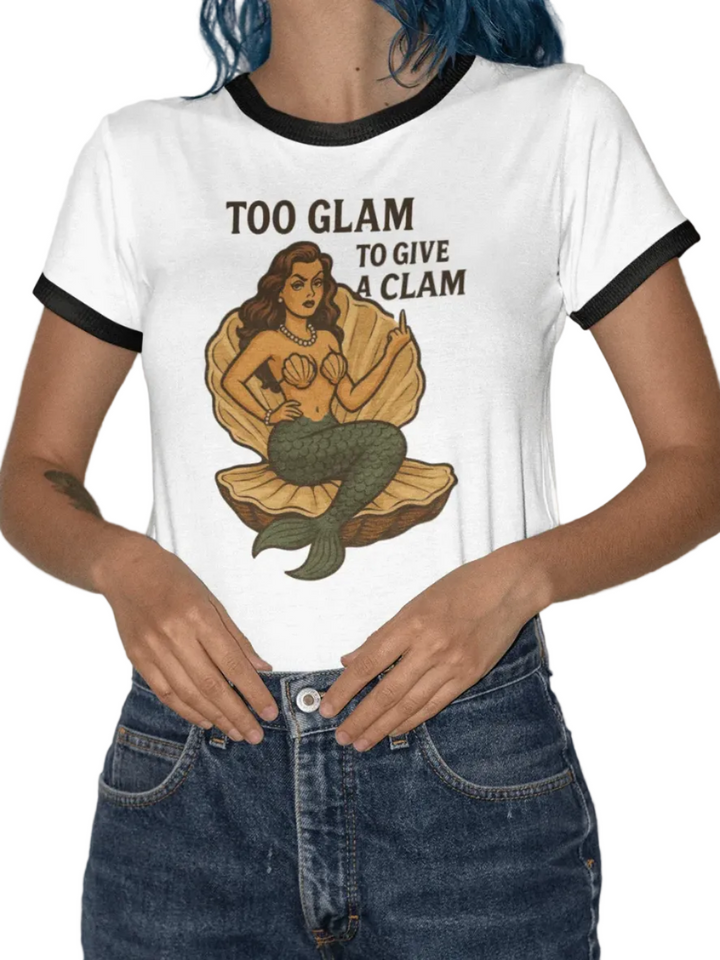 Model wearing Too Glam to Give a Clam women's ringer tee with a mermaid graphic, showcasing beach style.