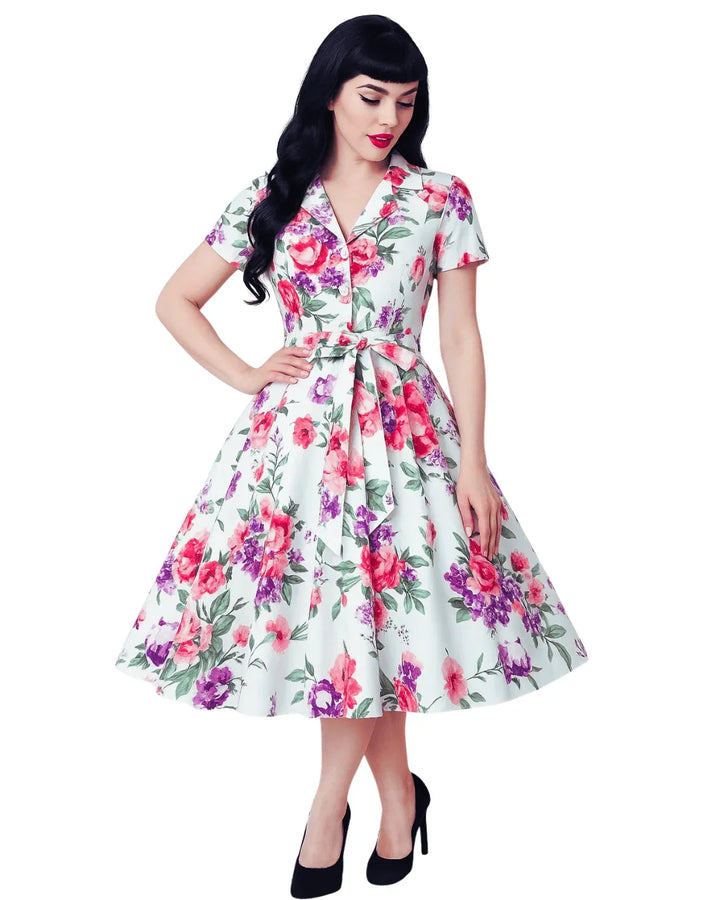 Woman wearing a floral dress on a white background